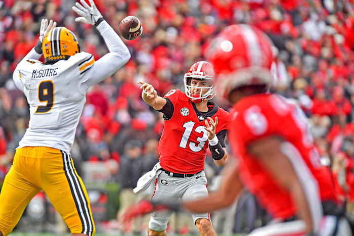Stetson Bennett throws a pass upfield during 2021 game.